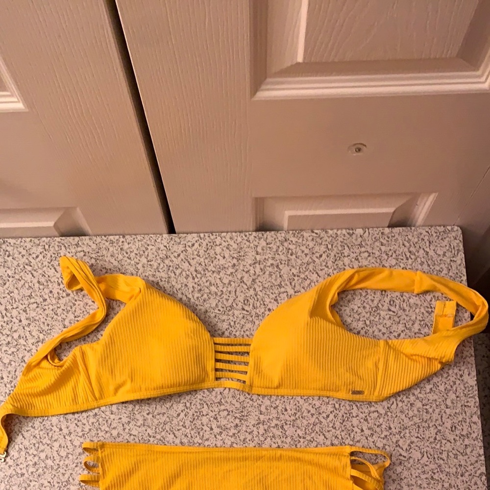 Yellow swimsuit bikini top only
